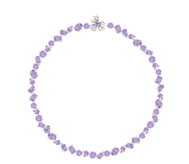 Silver-toned necklace with a mix of purple amethysts (round, square, oval cuts) and a flower-shaped clasp. Dense, vibrant gemstone design, perfect for elevating formal or semi-formal outfits.