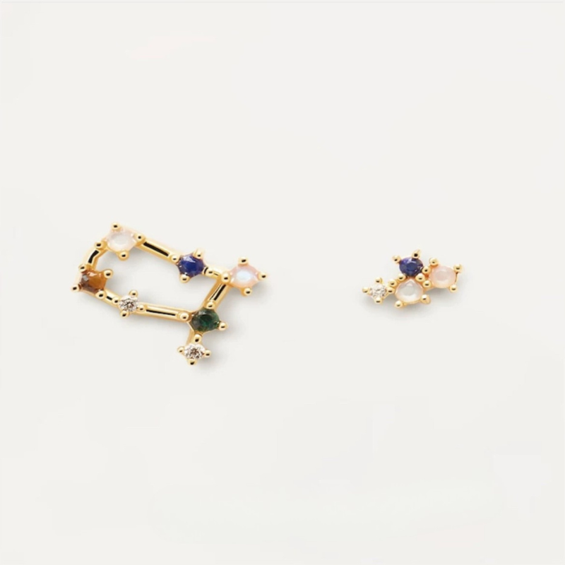 Gold-toned asymmetrical Gemini constellation earrings: multi-gem star pattern. Unique, symbolic for Gemini lovers.