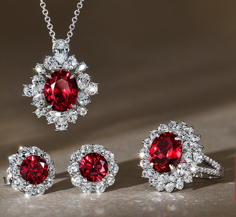 January Birthstone Garnet Jewelry Set – Includes necklace, ring, and earrings, featuring oval genuine garnet stones surrounded by clear accent stones in a silver-toned setting. A cohesive elegant set for January celebrations.