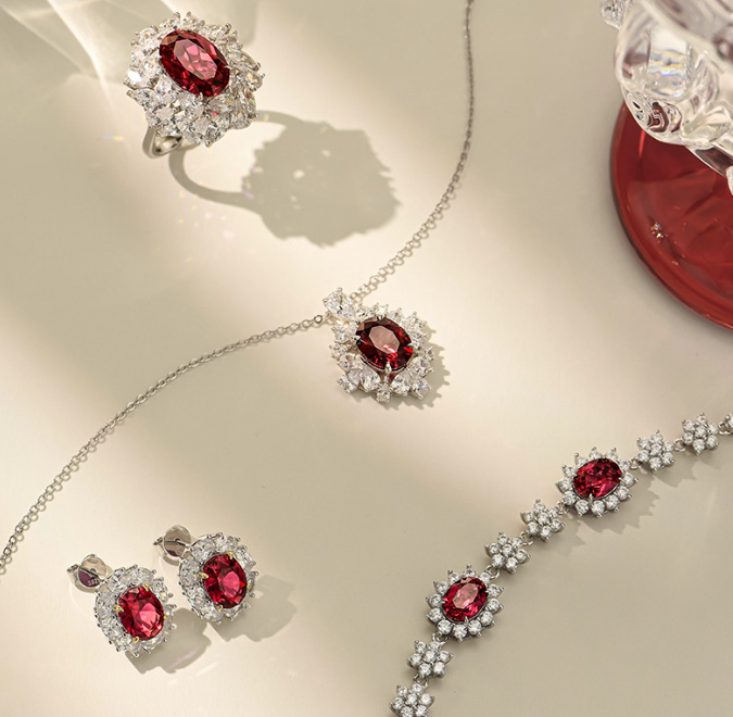 Silver-toned Cancer jewelry set (necklace, ring, bracelet, earrings): ruby (zodiac stone) with diamond accents. Cohesive warm design, great for gifting.