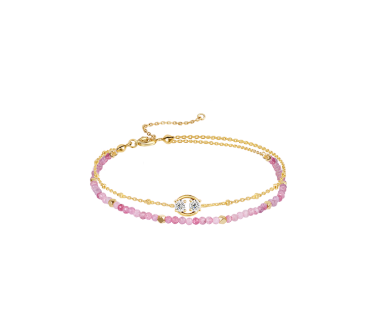 Gold-toned Cancer double-layer bracelet: ruby bead strand + Cancer symbol charm. Delicate stackable design, suitable for daily wear.