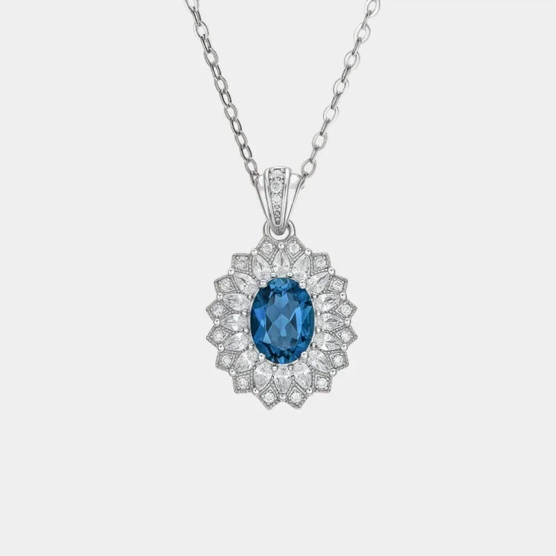 Oval Blue Topaz Floral Halo Pendant Necklace — isolated full necklace or pendant view