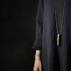 Handmade Ebony Wood & Antique Brass Pendant Necklace, shown worn for scale and styling