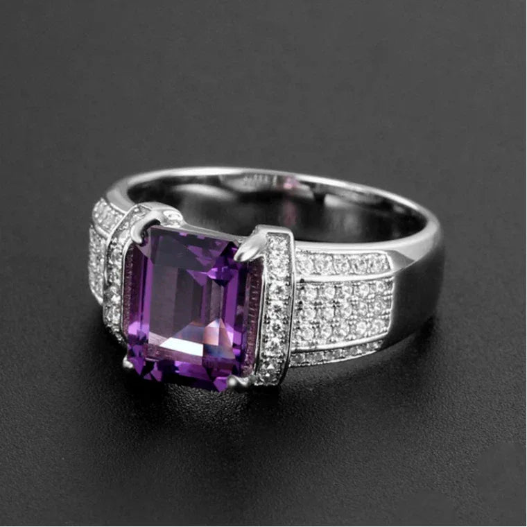 men's emerald-cut amethyst pavé ring front setting detail on a dark background