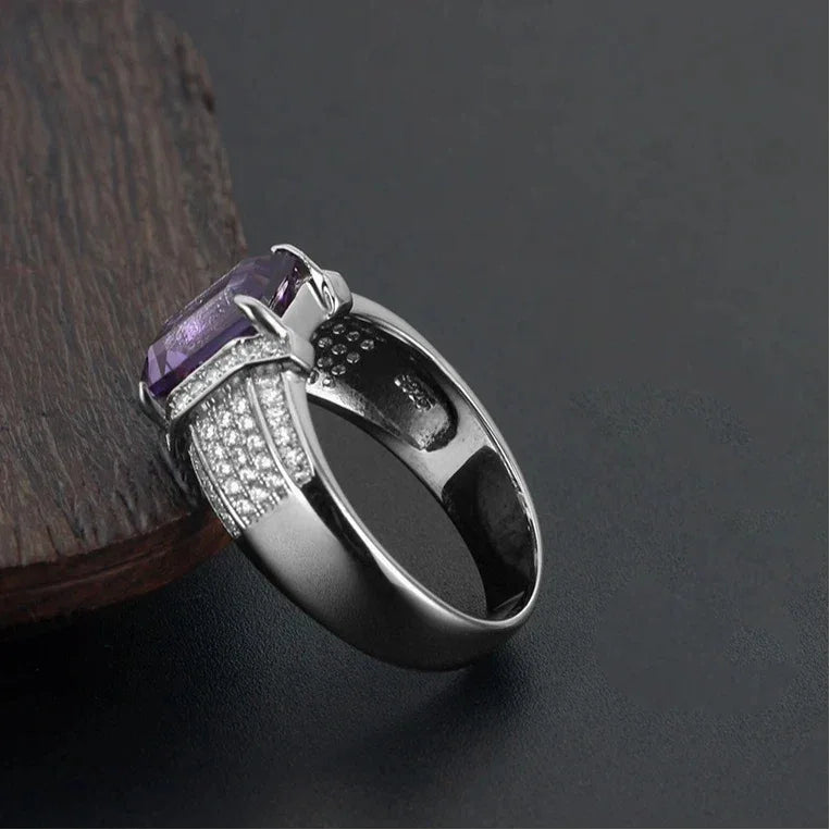 men's emerald-cut amethyst pavé ring low-angle product view on a dark background