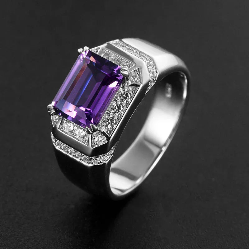 men's emerald-cut amethyst halo ring low-angle product view on a dark background