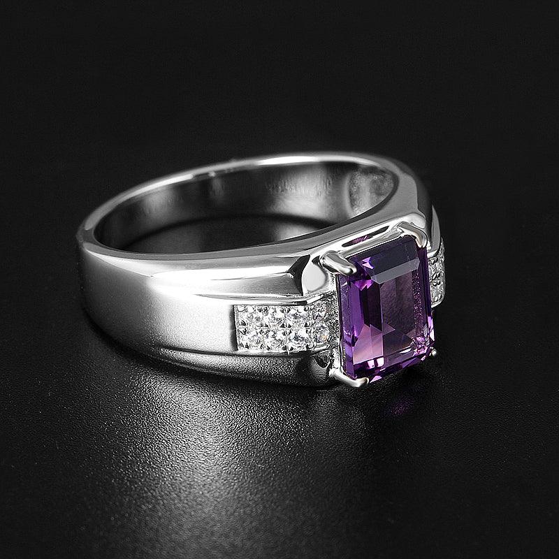 men's emerald-cut amethyst ring low-angle product view on a dark background