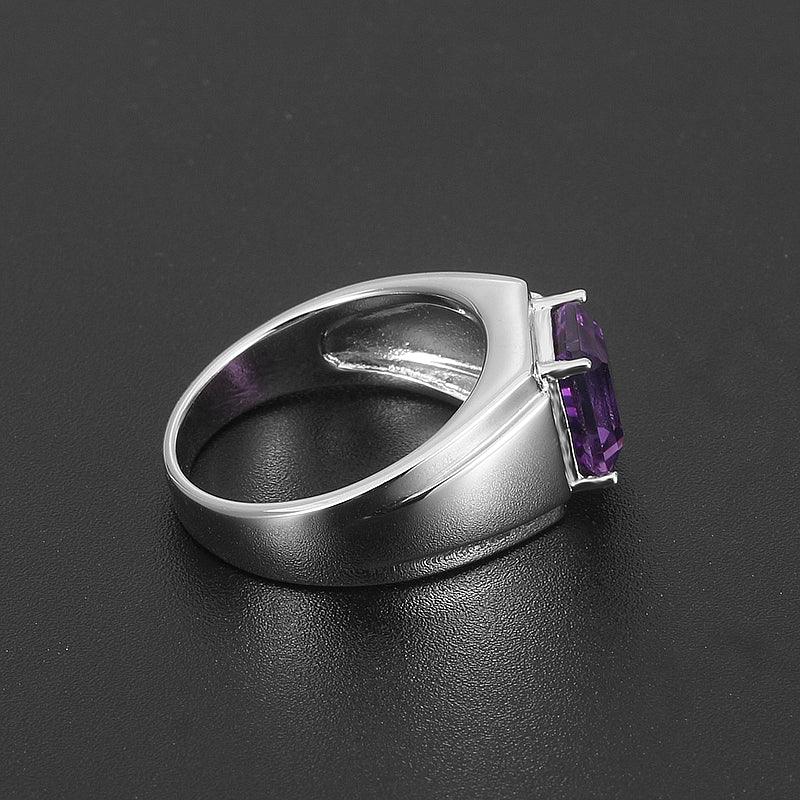 men's emerald-cut amethyst ring front setting detail on a dark background