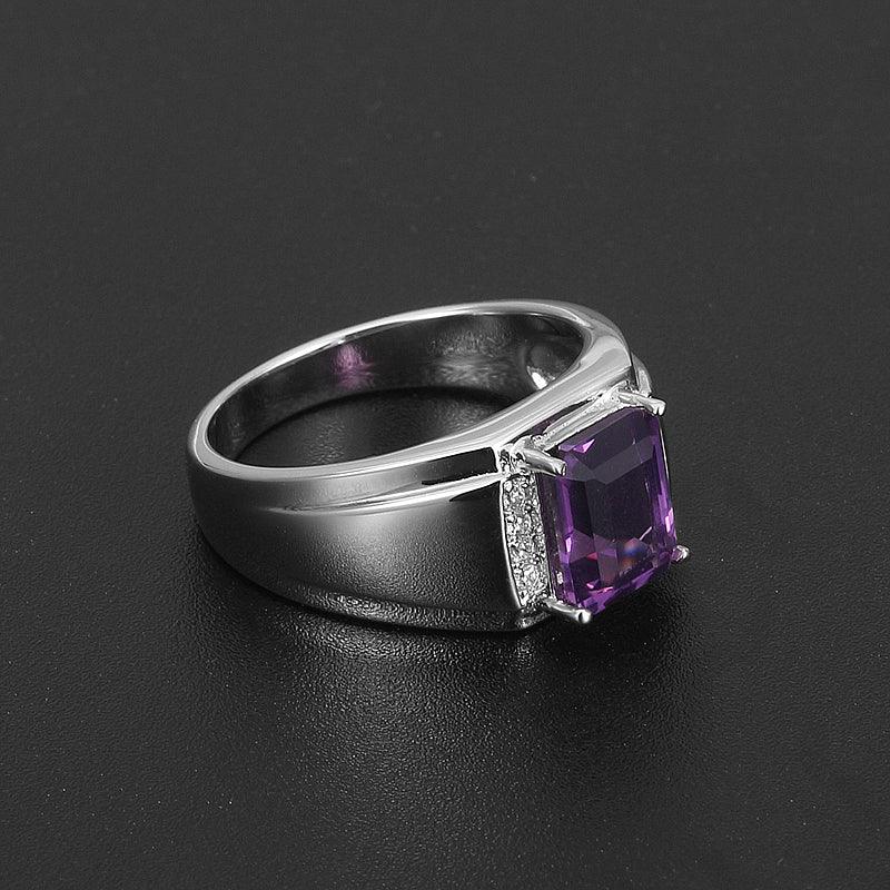 men's emerald-cut amethyst ring low-angle product view on a dark background