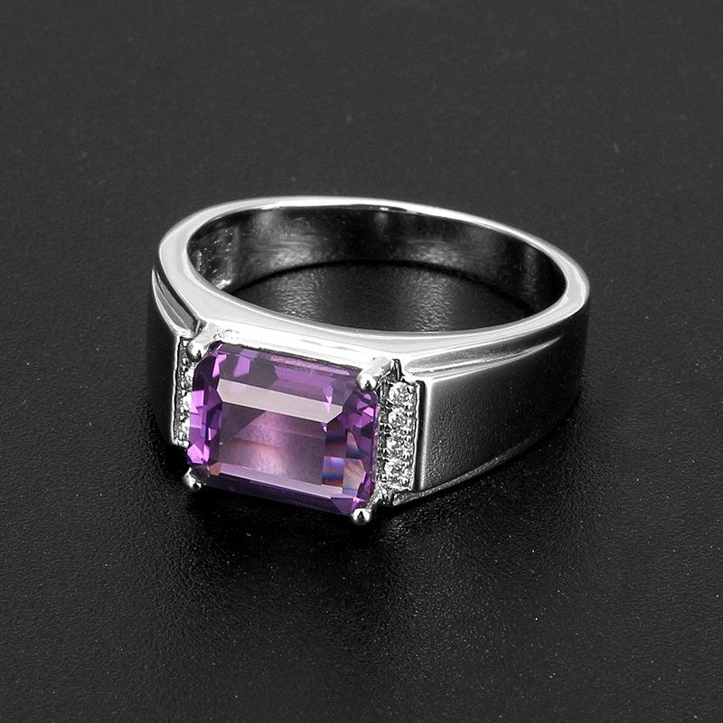men's emerald-cut amethyst accent ring front setting detail on a dark background