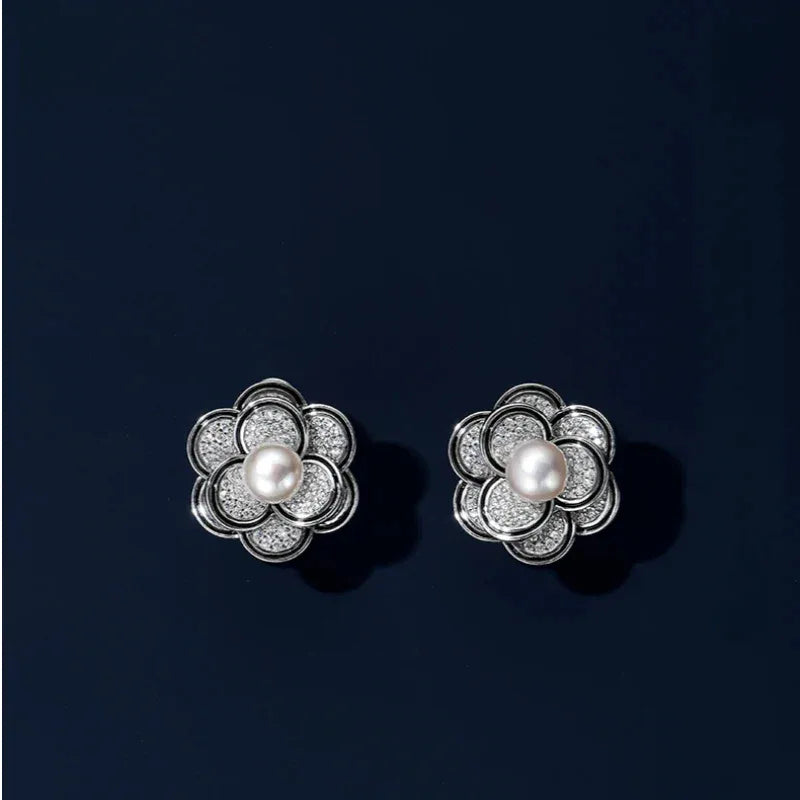 Freshwater Pearl Camellia Stud Earrings — front pair displayed on a dark background