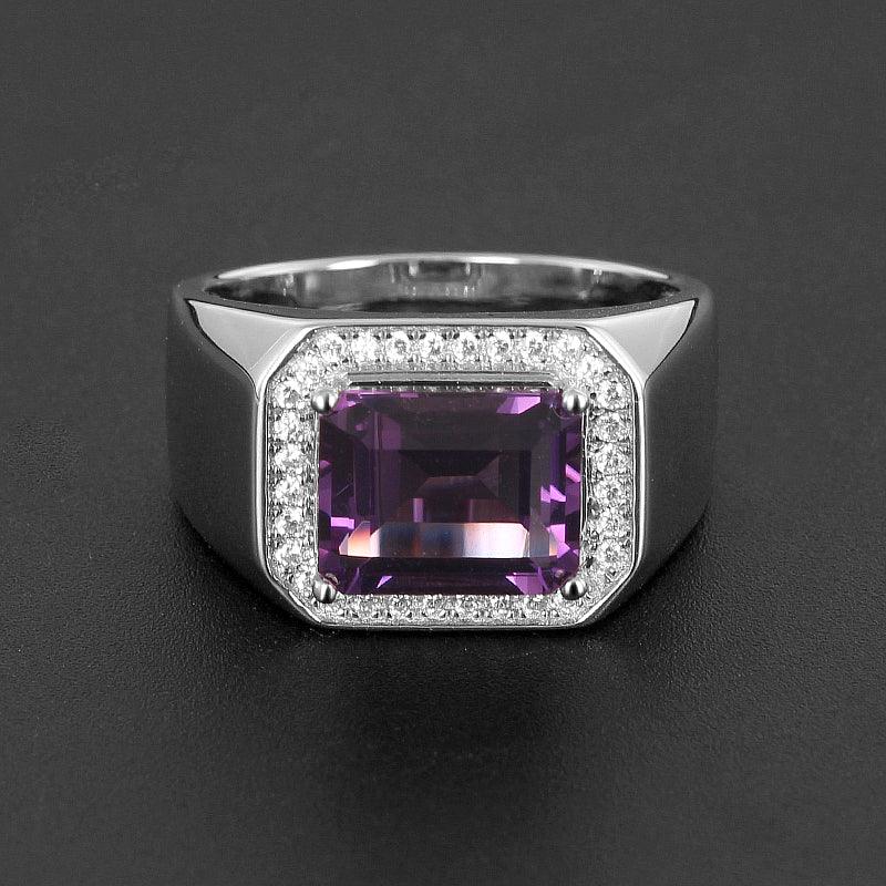 men's emerald-cut amethyst halo ring front setting detail on a dark background