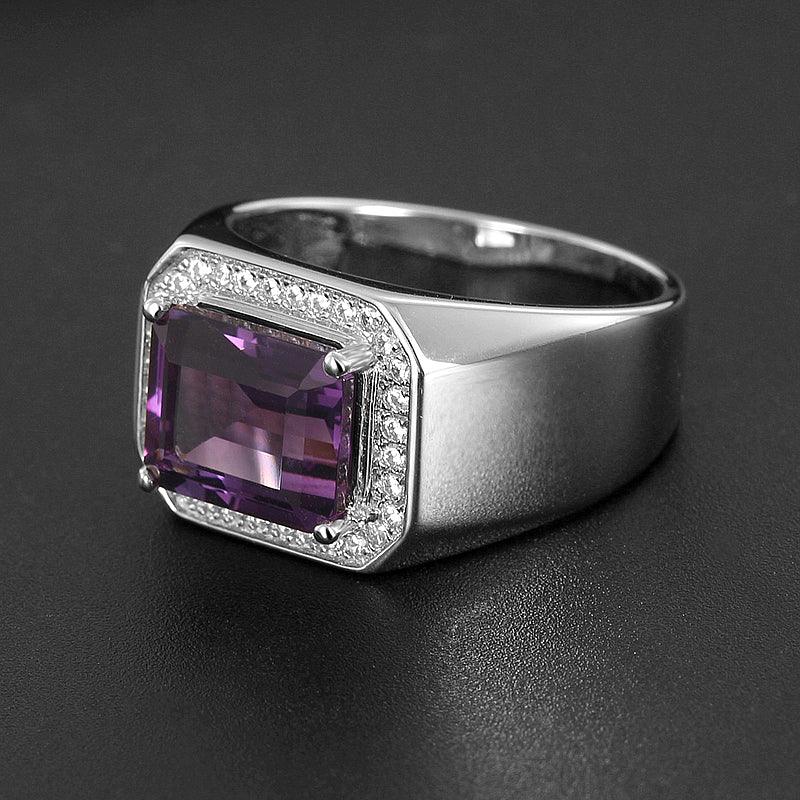 men's emerald-cut amethyst halo ring low-angle product view on a dark background