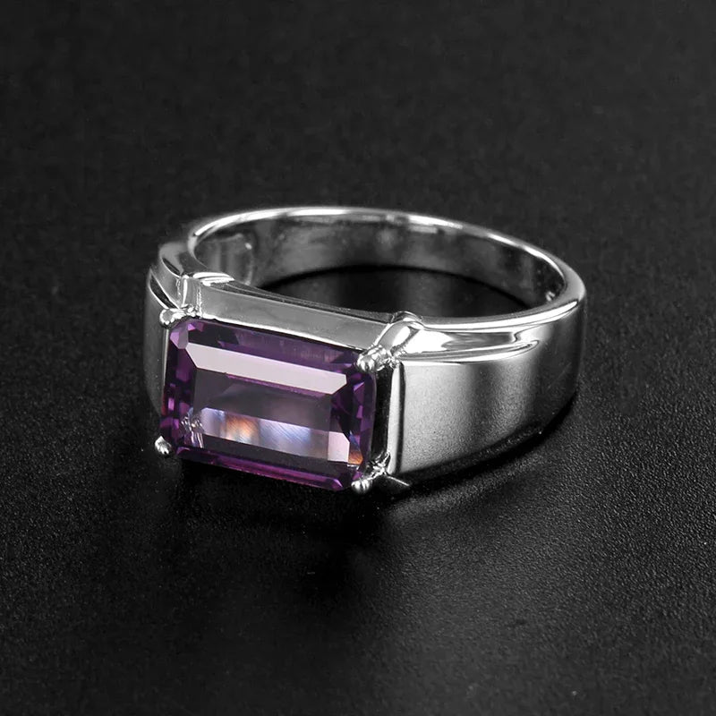 men's emerald-cut amethyst solitaire ring front setting detail on a dark background