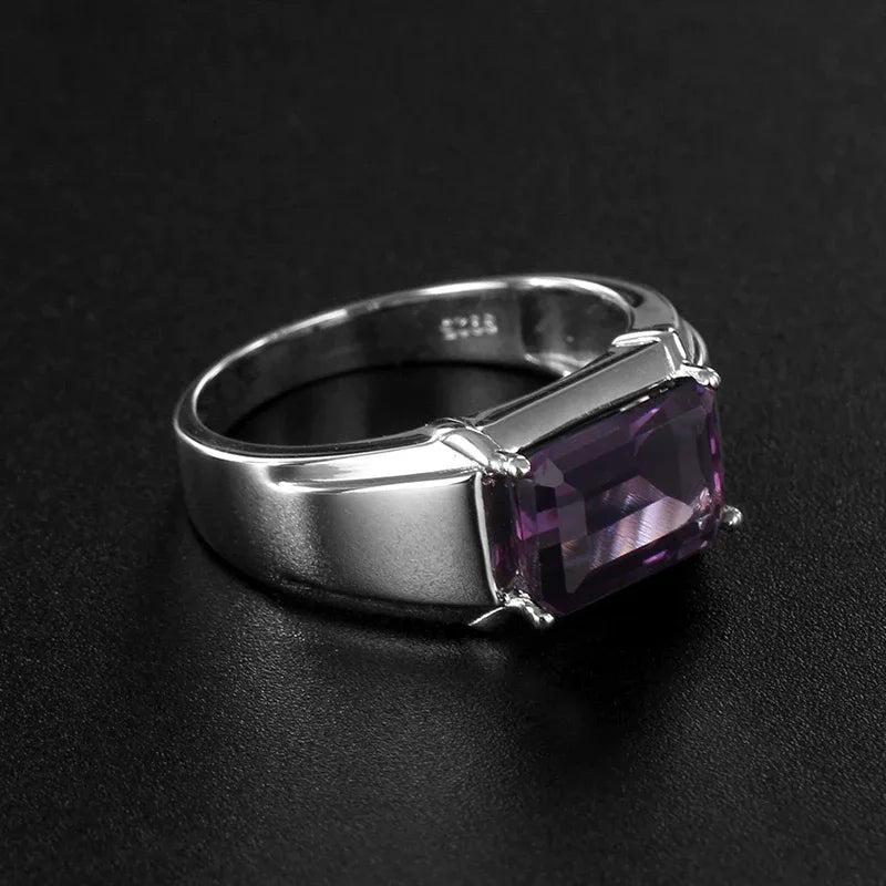 men's emerald-cut amethyst solitaire ring low-angle product view on a dark background