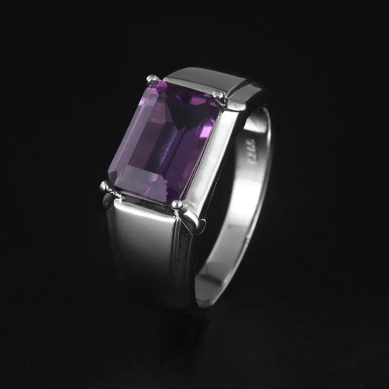 men's emerald-cut amethyst solitaire ring three-quarter product view on a dark background