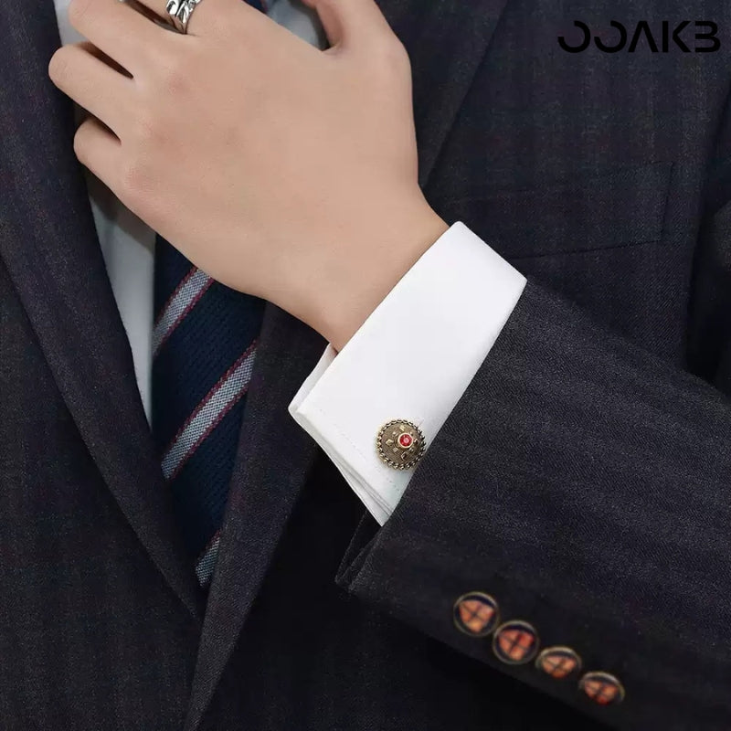 Detail of sparkling crystal on gold-plated cufflinks, showcasing shine.