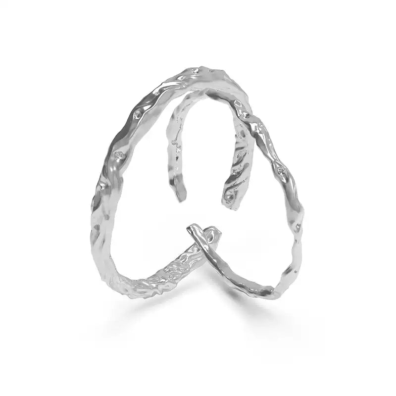 A silver couple ring (female ring) with a textured, wave-like design. Comes with packaging including a box, wrapped cloth, and small items. Ideal as a customized wooden wedding gift.