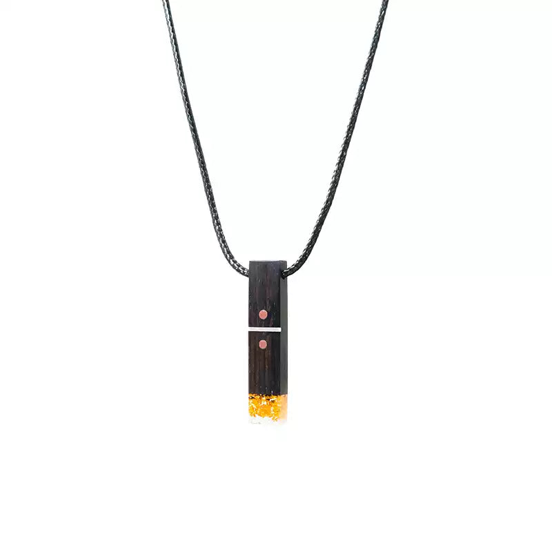 A black sandalwood pendant necklace with a 4 cm length, featuring pure silver accents, purple copper details, and resin at the bottom. Perfect for a wooden wedding gift, customizable with engraved words.