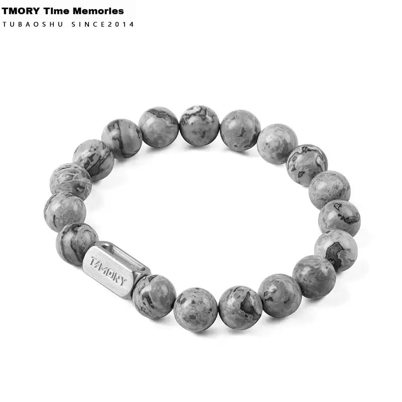 Memory Bracelet, strung with gray marble-textured stone beads and featuring a metal plate engraved with the brand logo. Its minimalist design embodies the meaning of time memory, suitable for customization as a memorial gift or daily wear.