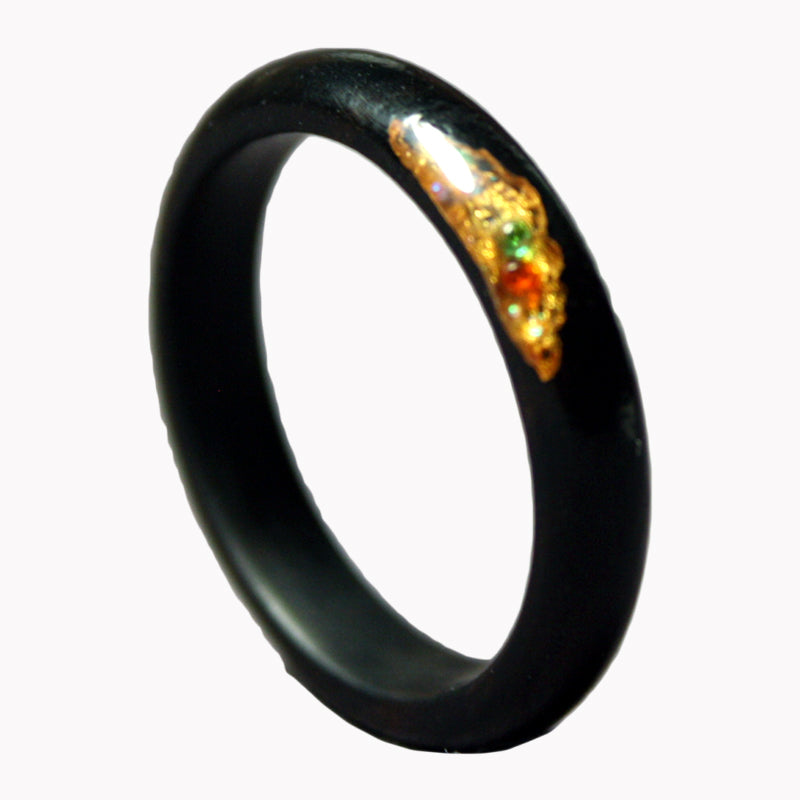 A sleek black sandalwood couple ring with a touch of gold detailing. Ideal as a unique wooden wedding gift, offering free engraving for a personal touch. Perfect for Valentine's Day or special occasions.