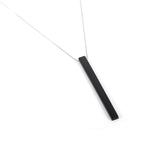 This customized wooden necklace features a sleek black rectangular pendant on a delicate rose gold chain. It's a perfect wooden wedding gift, allowing personalization for a unique touch. Ideal for couples celebrating their special occasion.