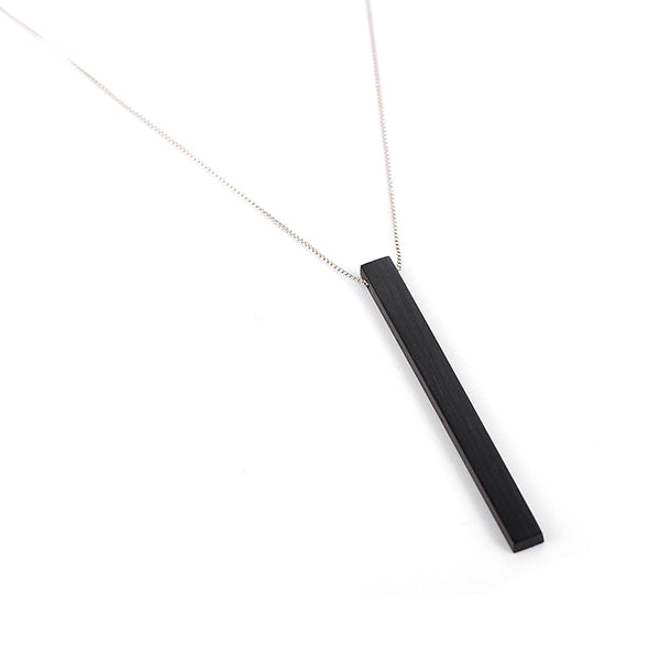 This customized wooden necklace features a sleek black rectangular pendant on a delicate rose gold chain. It's a perfect wooden wedding gift, allowing personalization for a unique touch. Ideal for couples celebrating their special occasion.