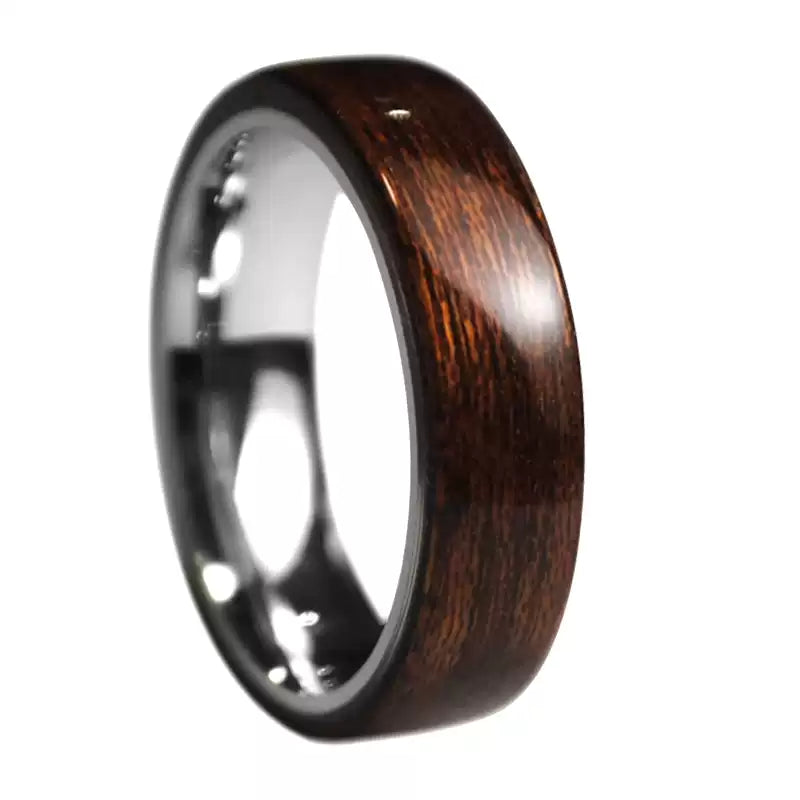 A handmade men's ring with an outer layer of ebony and an inner layer of titanium steel. Ideal for a special wooden wedding, customizable for uniqueness.
