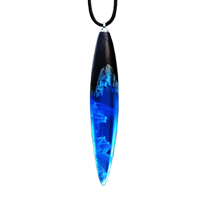 This necklace features a misty water drop resin pendant in blue, attached to a wooden pendant. It's a perfect customized wooden wedding gift, with free engraving available. Ideal for celebrating your special moment.