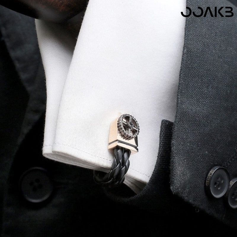 Leather-accented cufflinks on shirt, elegant for 3rd anniversary celebration.