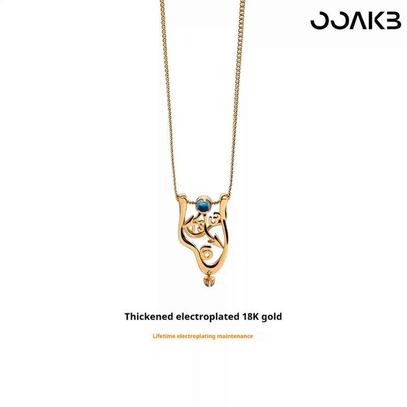 18K gold-plated Dali clock necklace with London Blue Topaz, symbolizing enduring love for paper wedding.