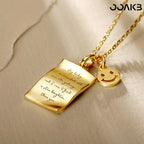 Close-up of engraved love note on gold pendant, symbolizing paper wedding devotion.