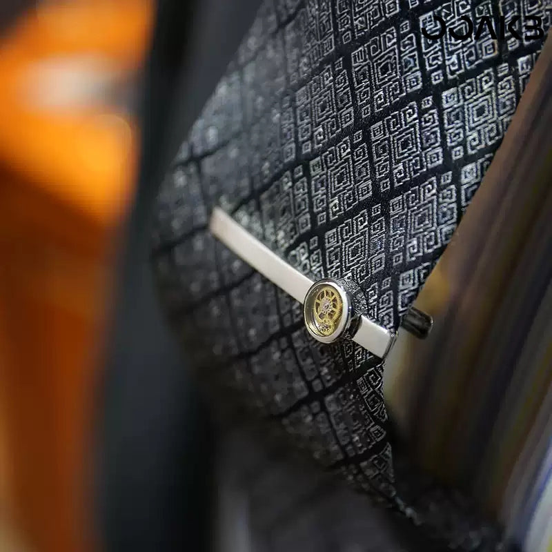 Man wearing clock gear tie clip on patterned tie, 1st anniversary style.