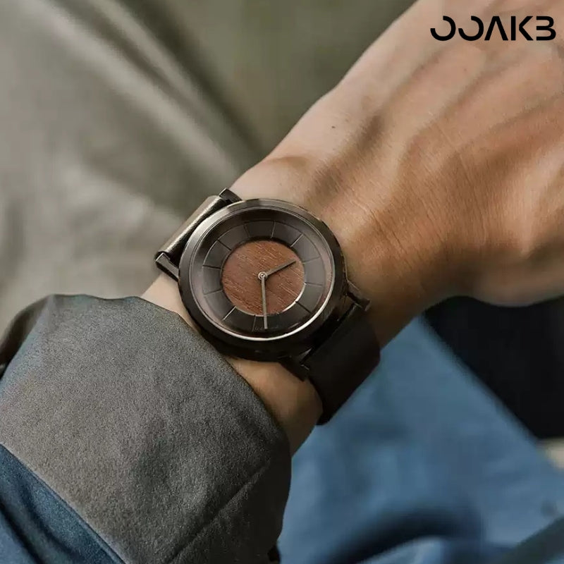 Man wearing wooden clock watch, blending minimalist style with paper wedding symbolism.
