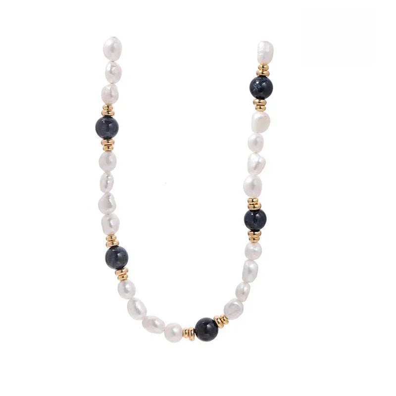Baroque Pearl and Tiger Eye Beaded Necklace — vertical close view showing the pearl and dark-bead spacing