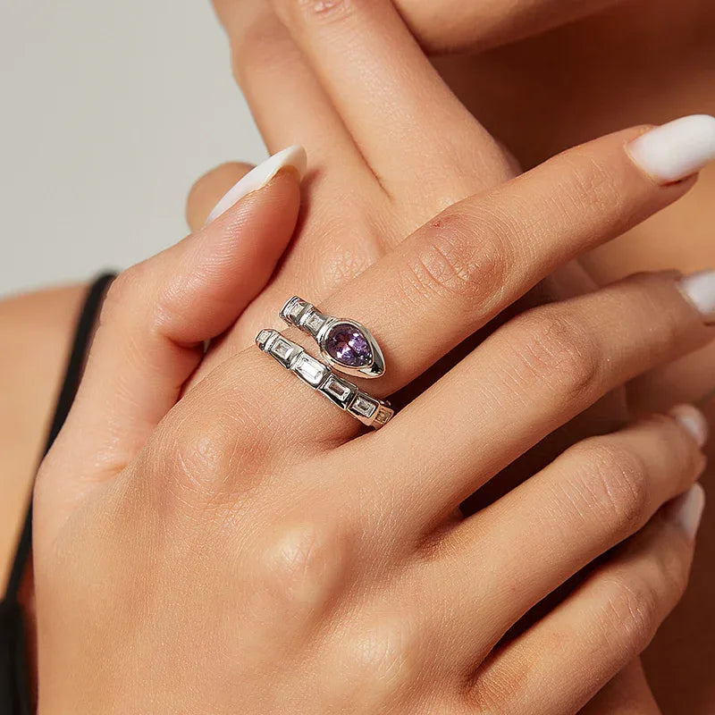 amethyst snake wrap ring worn on the hand in a close-up