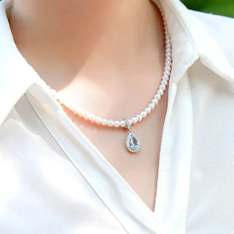 Aquamarine Teardrop Pendant Pearl Necklace — neckline-worn view over a white shirt