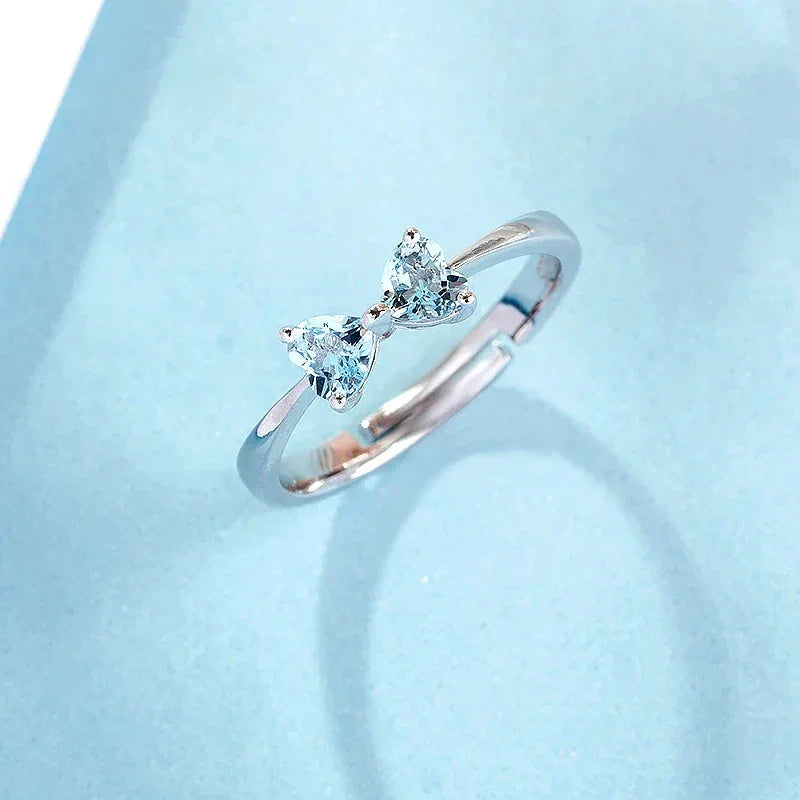 Aquamarine Bow Open Ring angled product view showing the setting