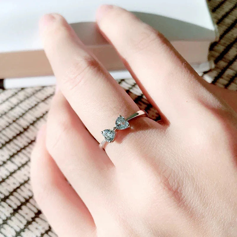 Aquamarine Bow Open Ring worn on the hand from a second angle