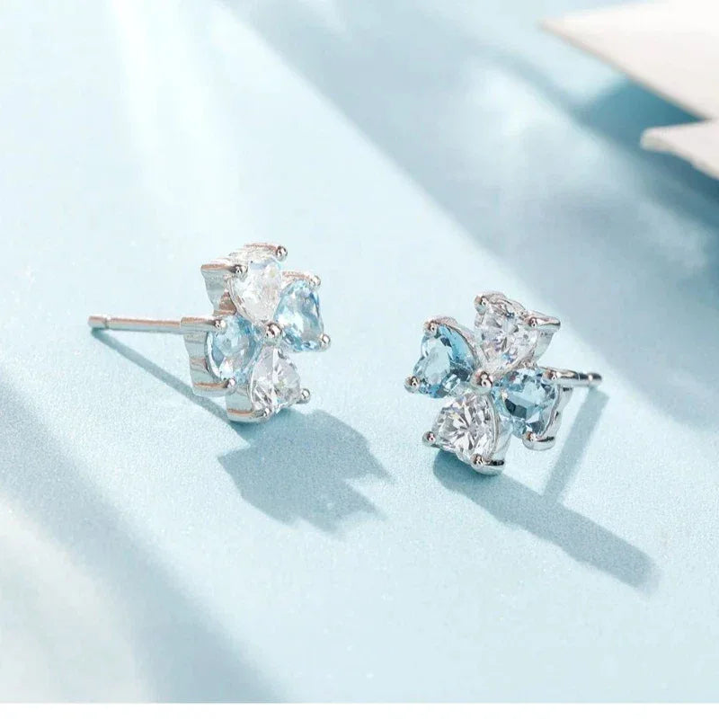 Aquamarine Bow Stud Earrings angled pair on a white background