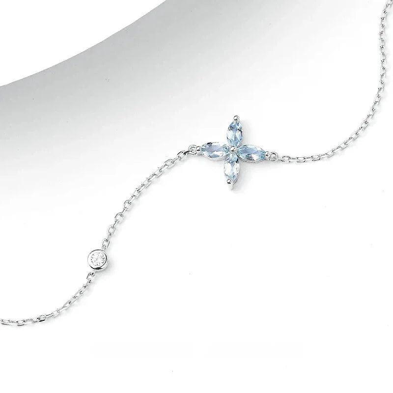 Aquamarine Cross Station Bracelet angled bracelet detail on white