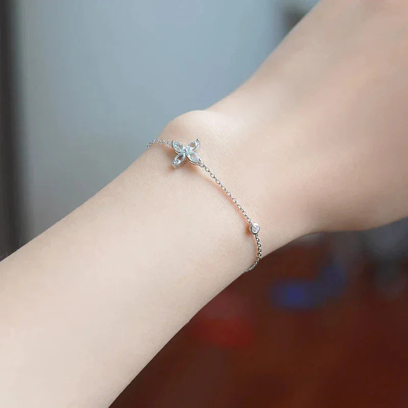 Aquamarine Cross Station Bracelet worn on the wrist from a second angle