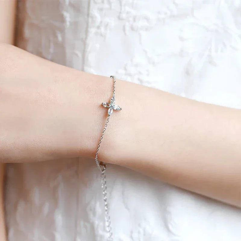 Aquamarine Cross Station Bracelet worn on the wrist in a close-up