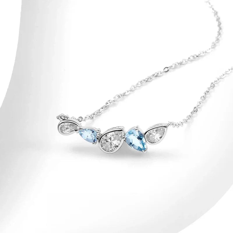 Aquamarine Five-Stone Curved Necklace angled pendant detail on white