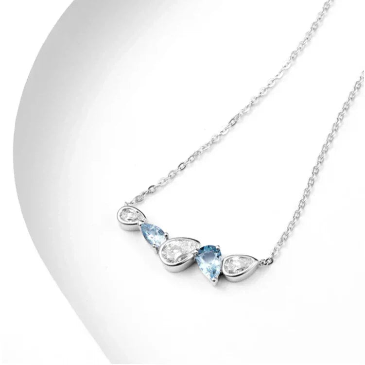 Aquamarine Five-Stone Curved Necklace styled neckline view showing pendant scale