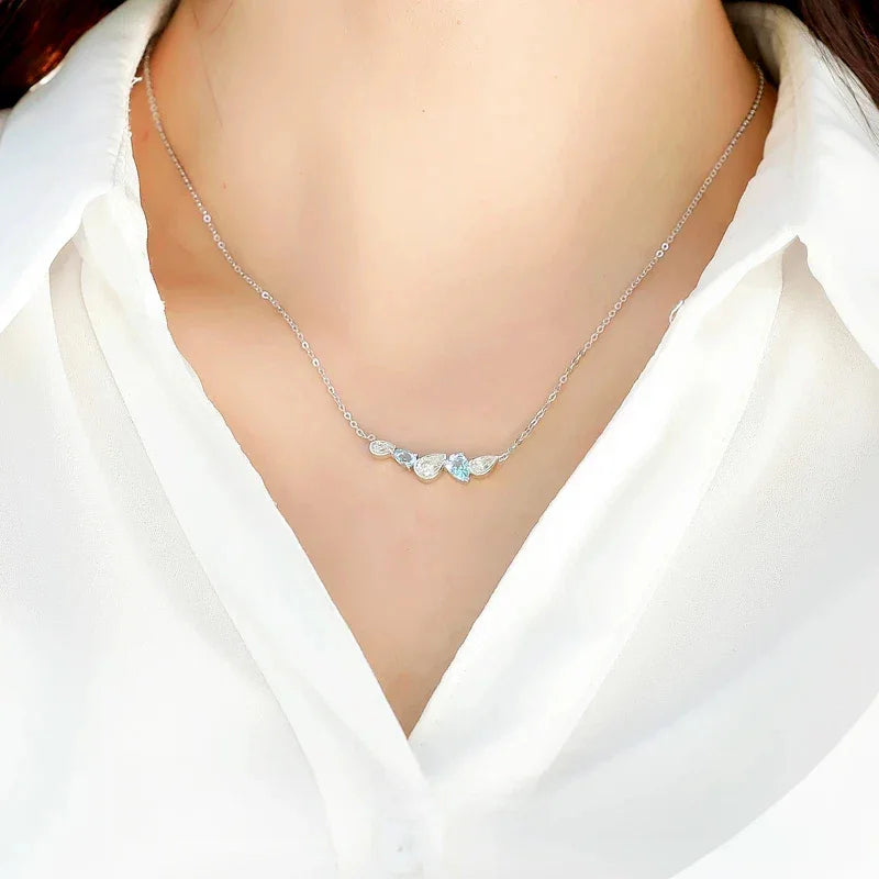 Aquamarine Five-Stone Curved Necklace worn at the neckline from a second angle