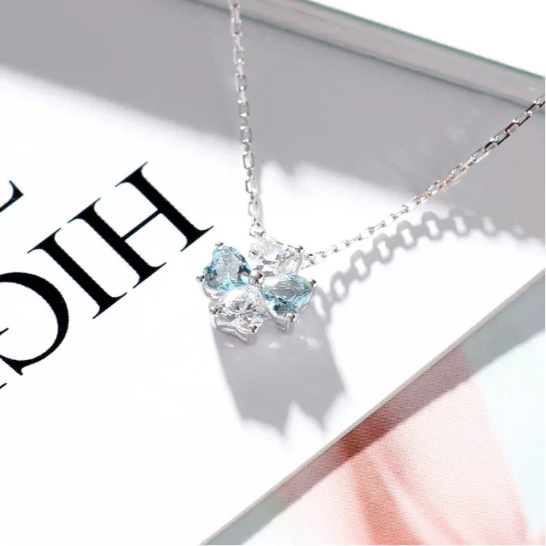 Aquamarine Four-Stone Cluster Pendant Necklace worn at the neckline from a second angle