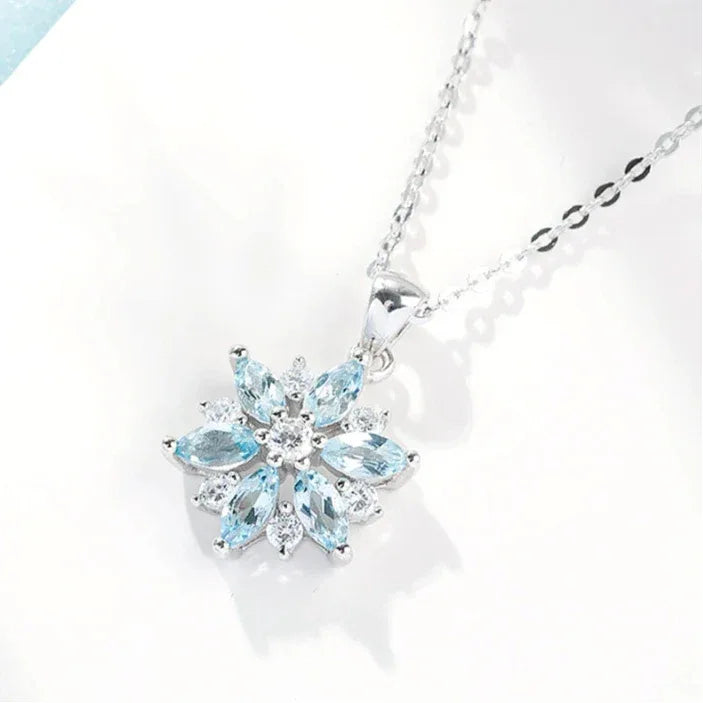 Aquamarine Snowflake Pendant Necklace angled pendant detail on white