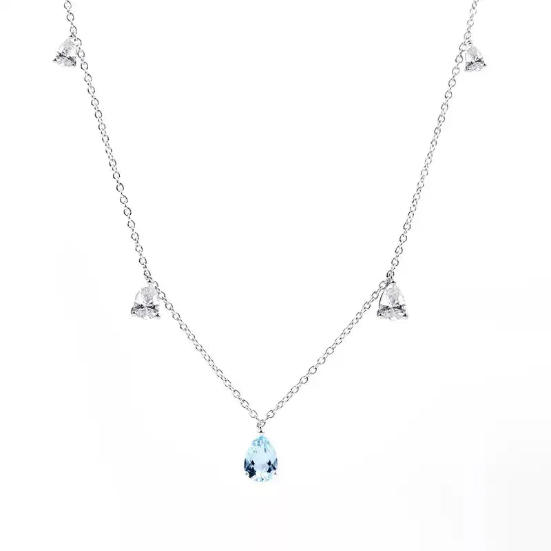 Aquamarine Station Drop Necklace pendant and chain detail on a light background
