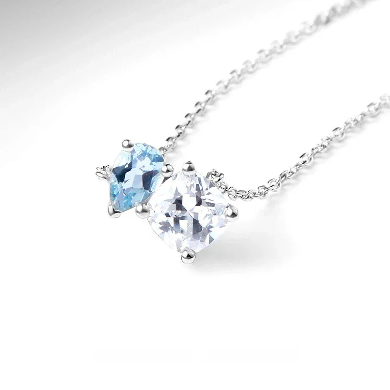 Aquamarine Two-Stone Pendant Necklace angled pendant detail on white